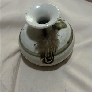 This is a vintage Roger Butler Feather River Pottery bud vase. 
I